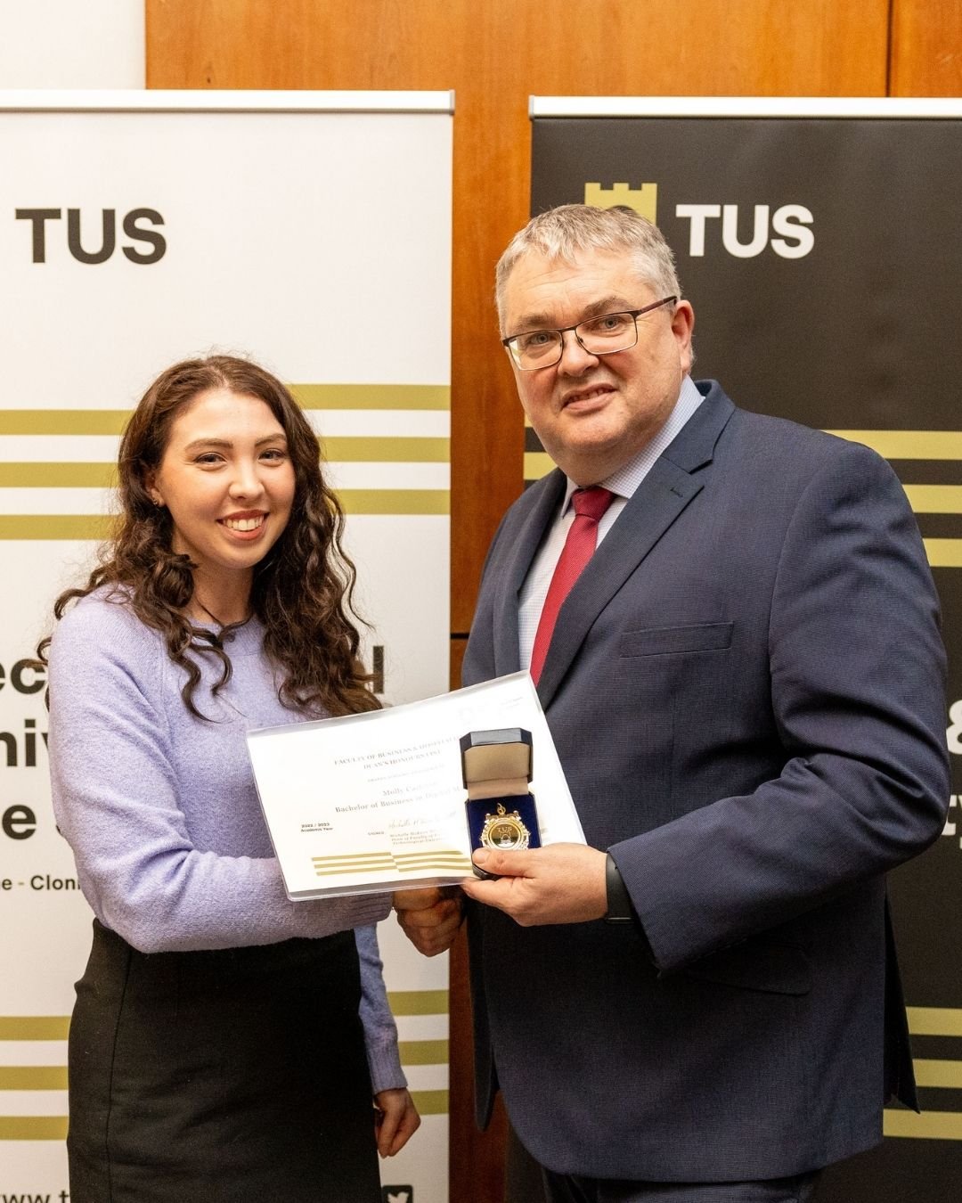 molly carleton accepting deans award